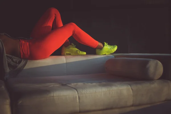 Woman in red sports pants.