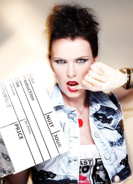 Bright woman with a clapperboard. — Stock Photo, Image