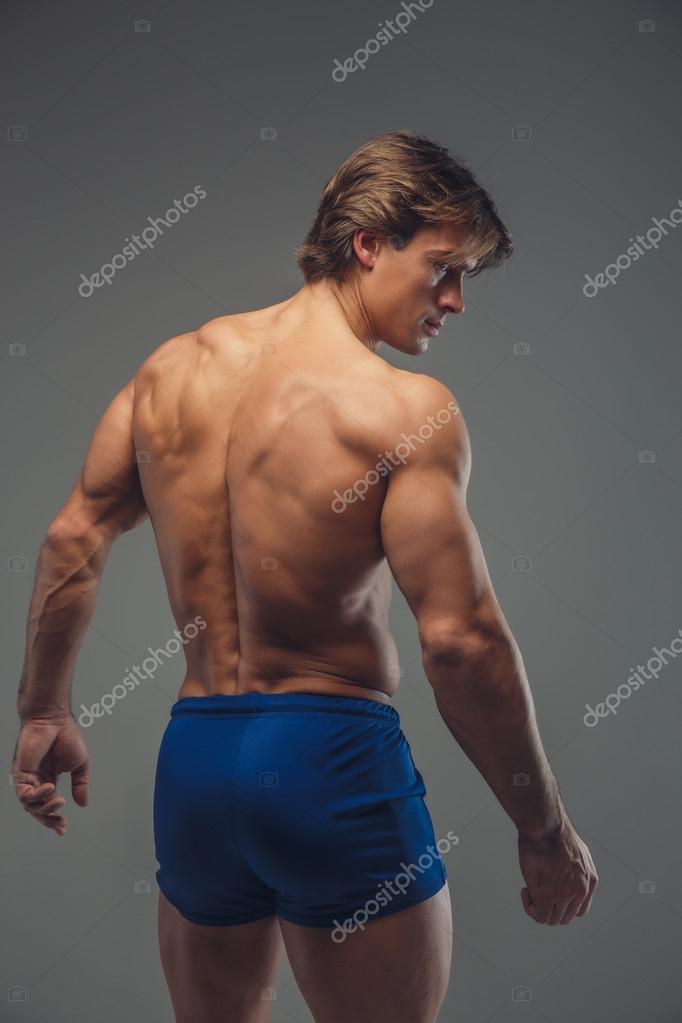 Muscular man's back Stock Photo by ©fxquadro 99323016