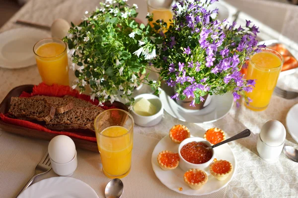 Festive continental breakfast with red caviar, soft-boiled egg a — Stock Photo, Image