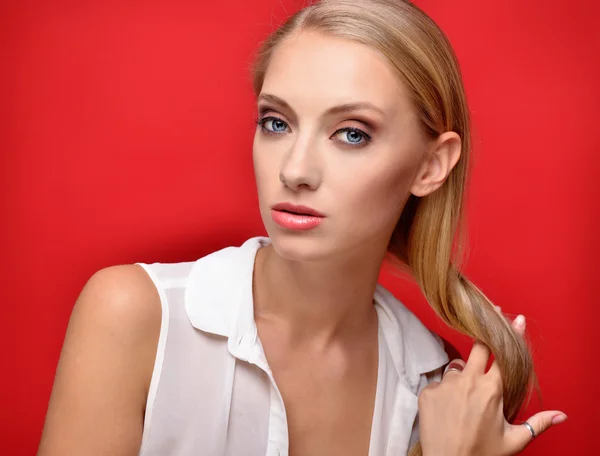 Portrait of the beautiful blonde woman in studio — Stock Photo, Image