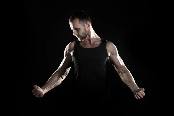 Muscular man,  hand, pumped up muscles, black background — Stock Fotó