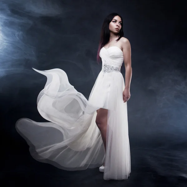 Beautiful sexy young woman. Portrait of girl in long white dress, mystical, mysterious style, dark background — Stock Photo, Image