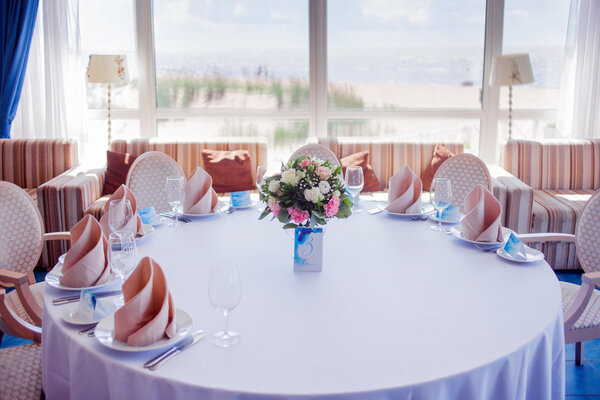 Wedding banquet, small restaurant in a Maritime style, round tables
