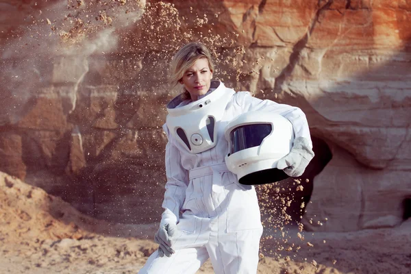 Futuristic astronaut without a helmet on another planet, image with the effect of toning — Stock Photo, Image