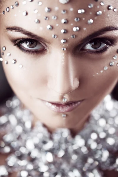 Beauty woman makeup with crystals on face, looking at the camera — Stock Photo, Image