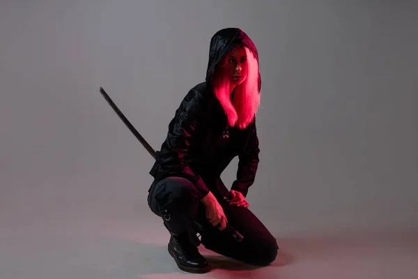 Techno cyber punk style, futuristic ninja, young woman with pink hair — Stock Photo, Image