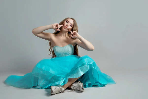 Beautiful and daring princess in a lush blue Cinderella dress — Stock Photo, Image