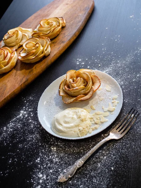 Apple roses, apple buns, serving with whipped cream and almond petals, — Stock Photo, Image