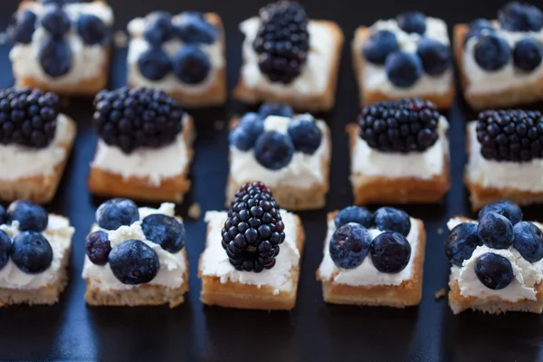 Plate of small waffles with cream cheese — Stock Photo, Image