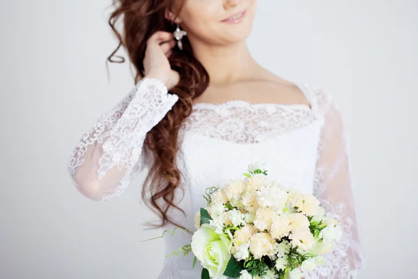 Portrait of happy bride in wedding dress, white background — Stock Photo, Image