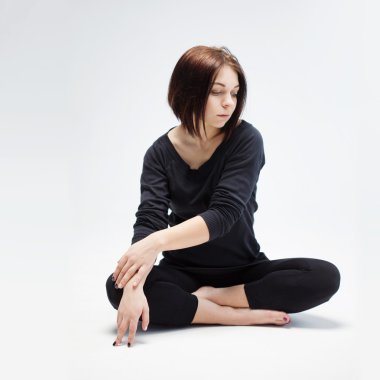  young beautiful woman sitting in lotus position, closeup clipart
