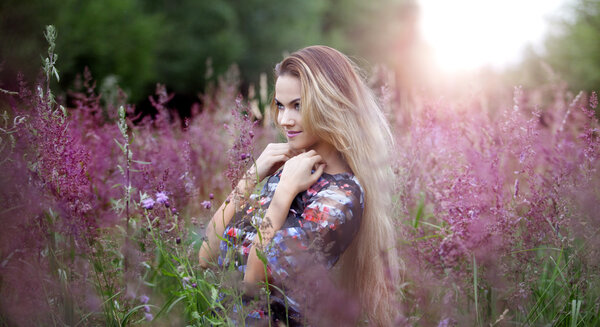 The young beautiful girl on a meadow