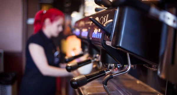 young girl Barista prepares coffee in pub, bar, restaurant