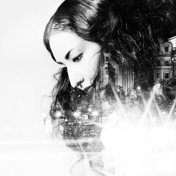 Double exposure of beautiful girl and  city lights at night, black and white toning — Stock Photo, Image