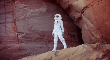 futuristic astronaut on another planet, image with the effect of toning clipart