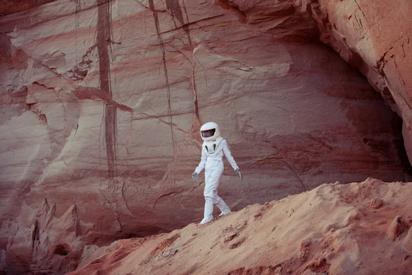Futuristic astronaut on another planet, image with the effect of toning — Stock Photo, Image