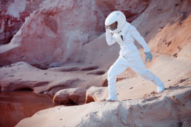 Water on Mars, futuristic astronaut, image with the effect of toning clipart