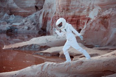 Water on Mars, futuristic astronaut, image with the effect of toning clipart