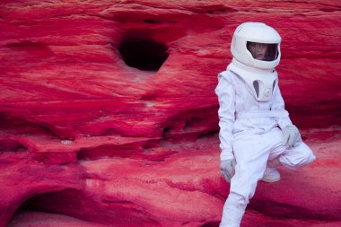 futuristic astronaut on crazy pink planet, image with the effect of toning clipart