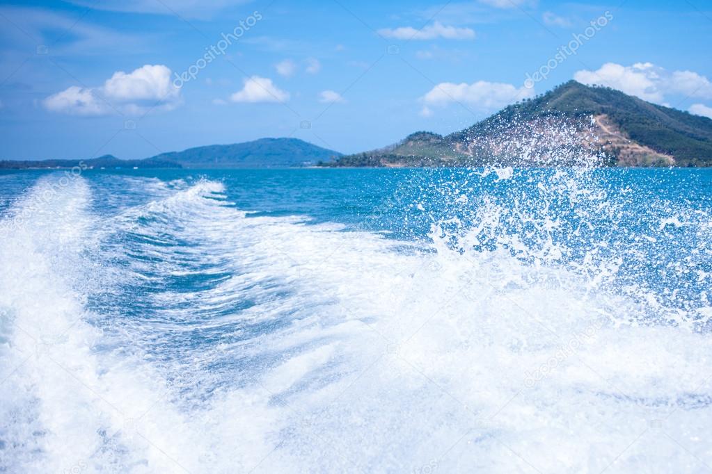 Water stream after speed boat. Summer landscape, a warm Sunny day on the Islands in Asia