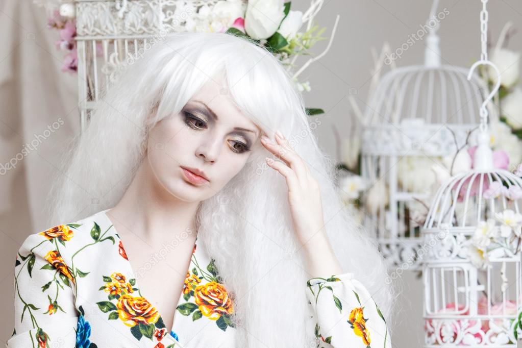 Beautiful girl with white hair in  background of cells, puppet style, floral decor