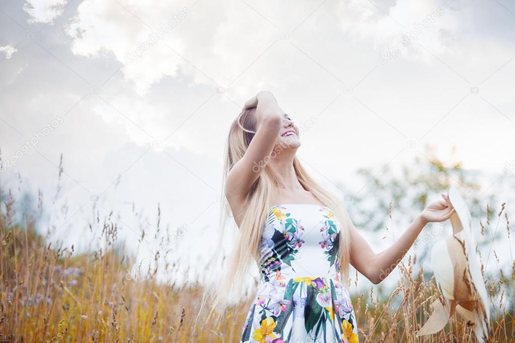 Beauty  women  in a straw hat alone with nature, freedom concept.