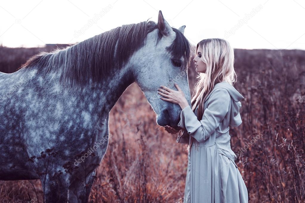 beauty blondie with horse in the field,  effect of toning