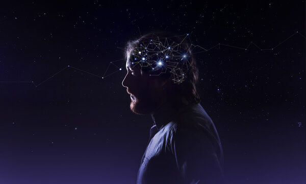 Profile of a bearded man head with  symbol neurons in brain. Thinking like stars, the cosmos inside human, background night sky