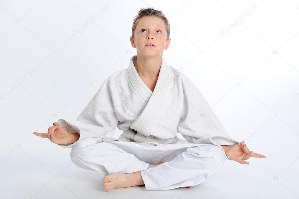 Meditating karate boy Stock Photo by ©serge75 107222340