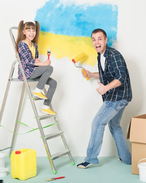 Father and daughter makes repairs at home