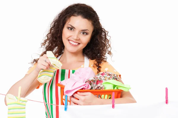 Housewife hanging clothes on the line — Stock Photo, Image