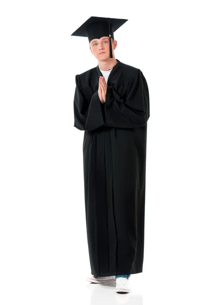 Graduate guy student in mantle - prayer — Stock Photo, Image