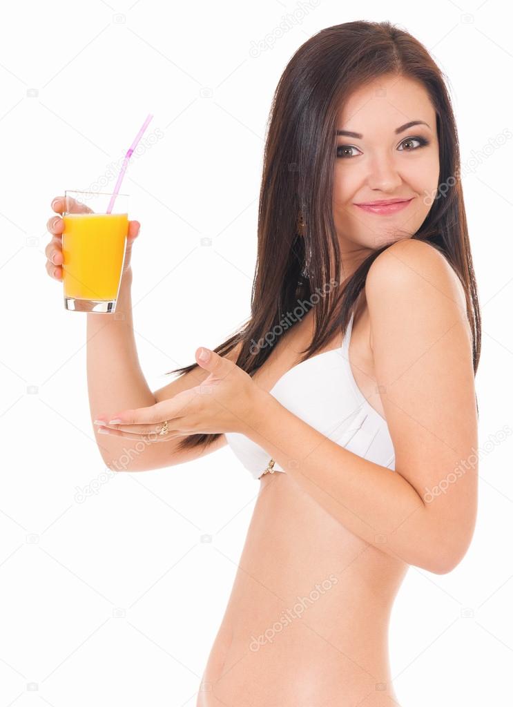Girl in bikini with orange juice