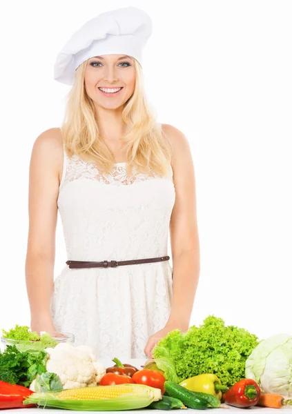 Mujer en sombrero de chef con verduras —  Fotos de Stock