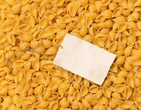 Gamla tomma papper på rå pasta — Stockfoto
