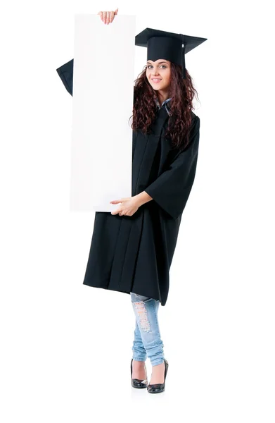 Woman graduating with signboard — Stock Photo, Image