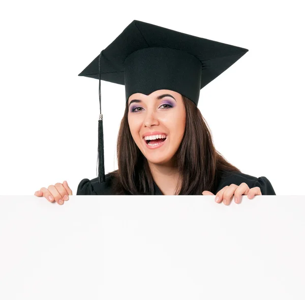Woman graduating with signboard — Stock Photo, Image