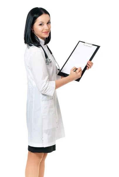 Female doctor holding clipboard — Stock Photo, Image