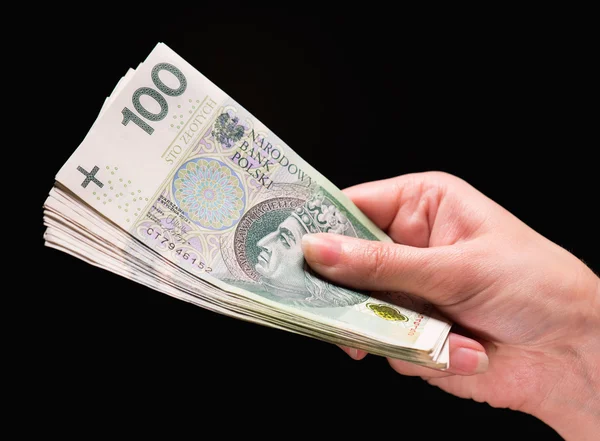 Vrouwelijke hand met geld — Stockfoto