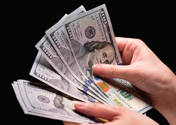 Mão feminina com dinheiro — Fotografia de Stock