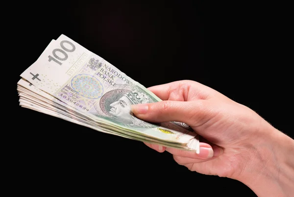 Vrouwelijke hand met geld — Stockfoto