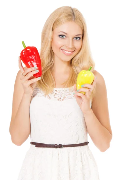 Woman holding fresh peppers — Stock fotografie