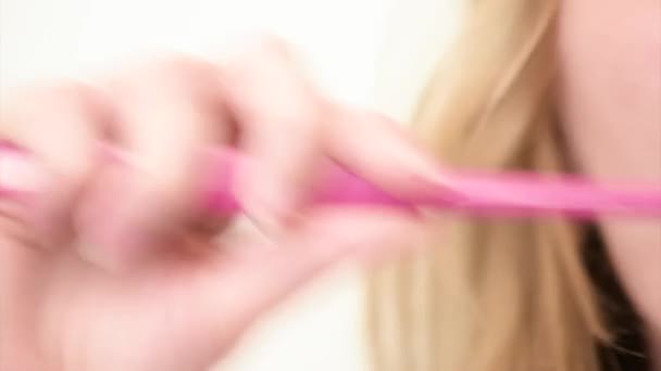 Woman brushing teeth in bathroom — Stock Video