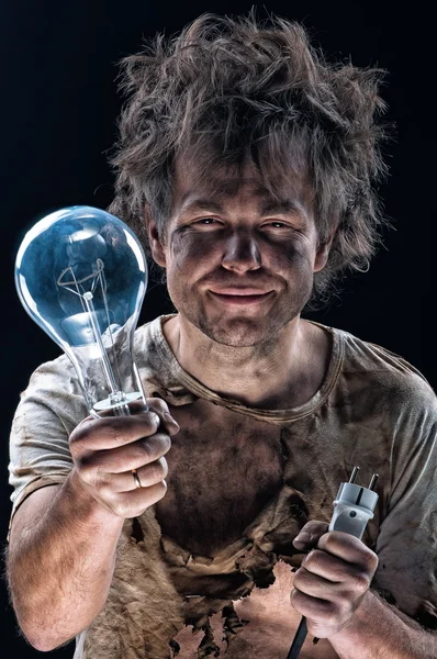 Burnt man with light bulb — Stock Photo, Image