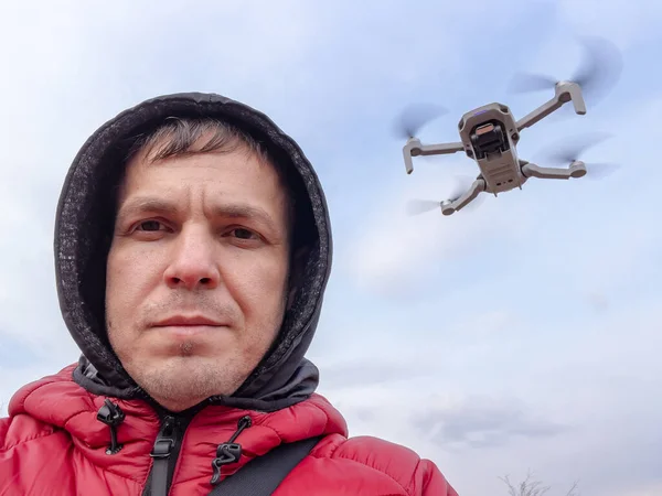 Man controls flying drone