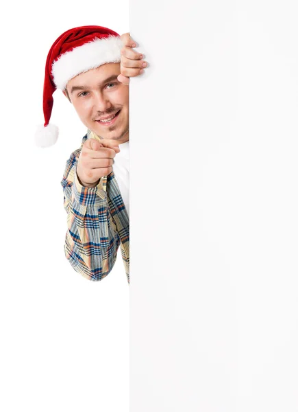 Jonge man in Kerstman hoed — Stockfoto