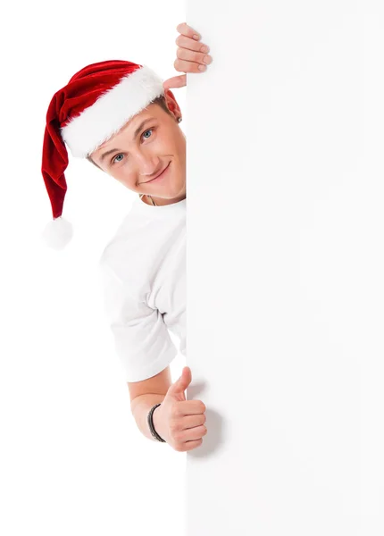 Junger Mann mit Weihnachtsmütze — Stockfoto