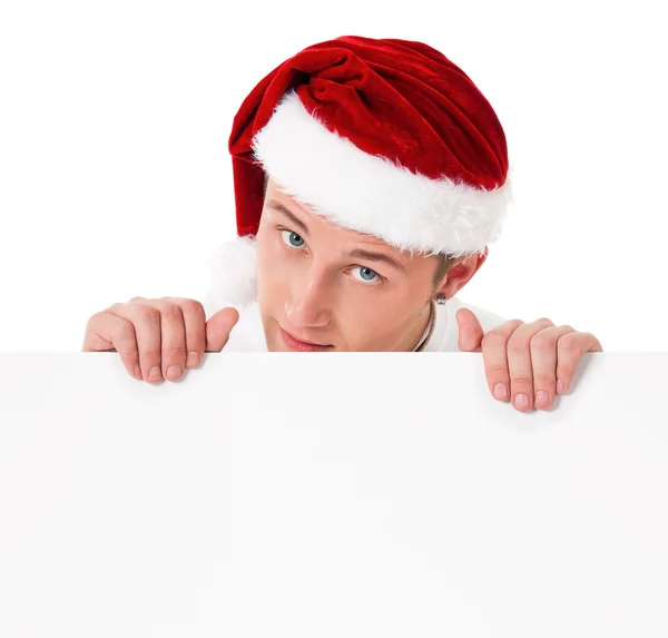 Genç adam Noel Baba şapkası — Stok fotoğraf