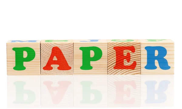 Word paper formed by wood alphabet blocks — Stock Photo, Image